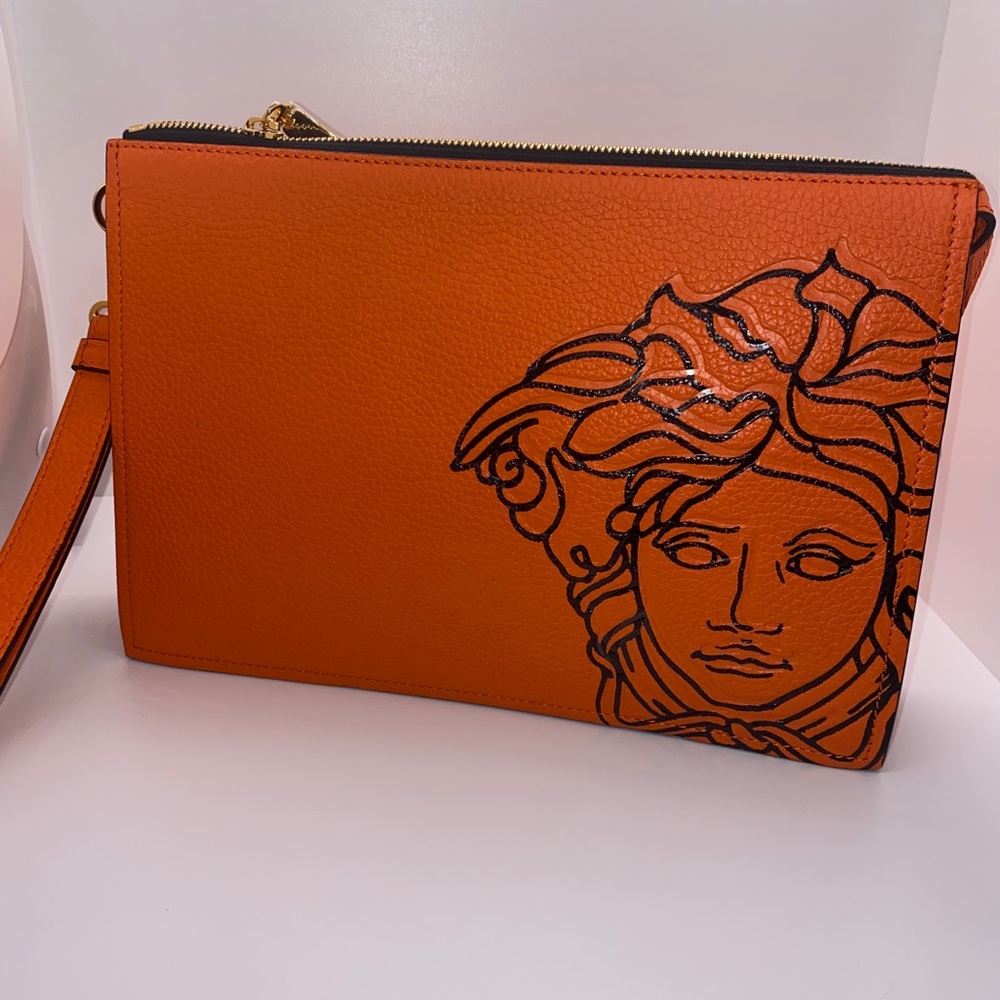 Versace orange Medusa head wristlet